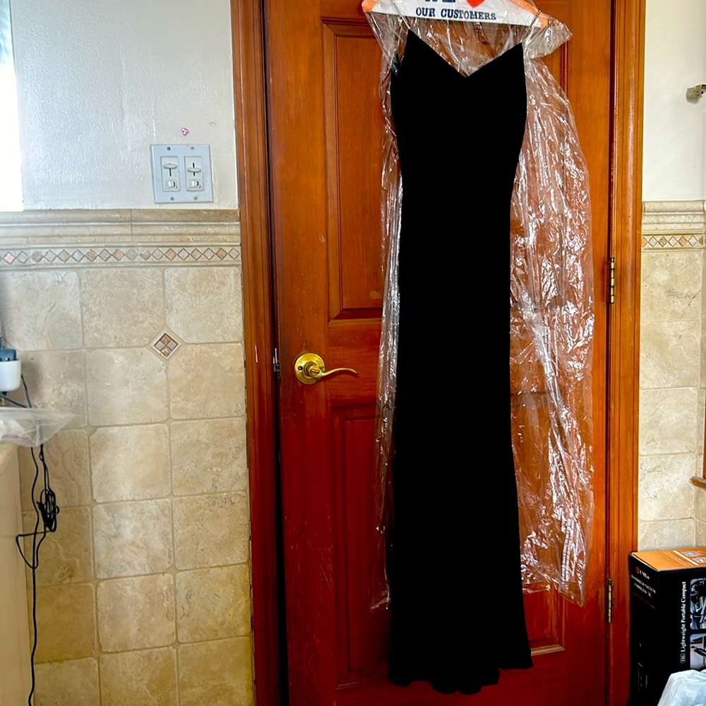 Long black formal dress. Size 4. Fully lined, rhinestone straps.